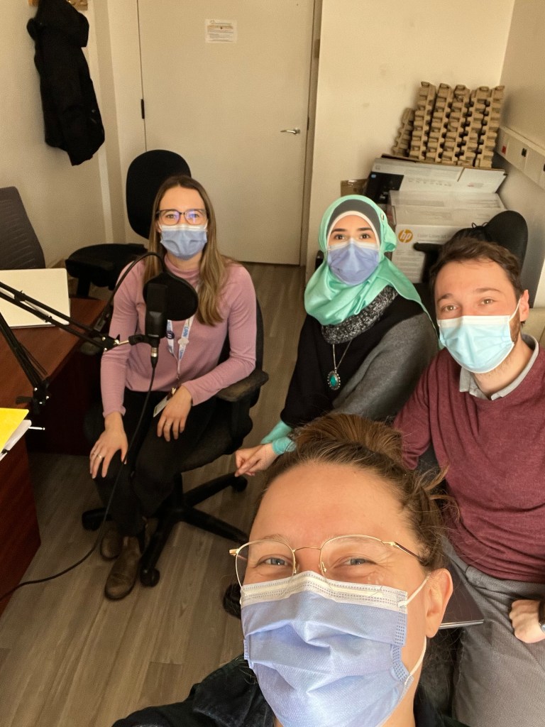 Four members of the Seeds of Science podcast team take a picture wearing face masks.